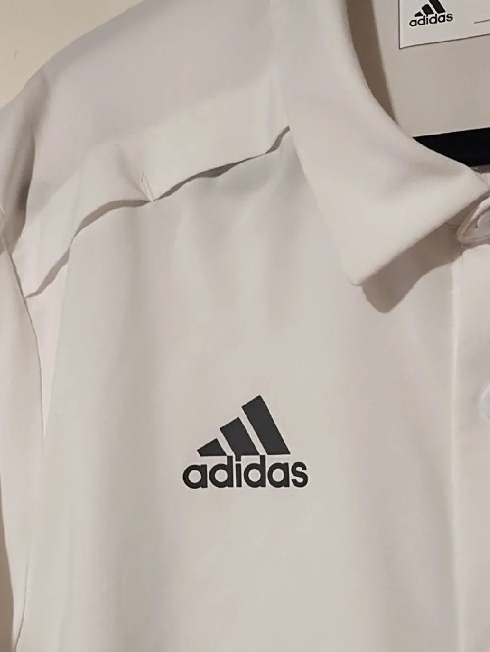 adidas EUC Medium AeroReady White Short-Sleeve Button Shirt with Black Logo.